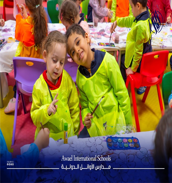 Students at Awael International Kindergarten are enthusiastically engaged in a coloring activity